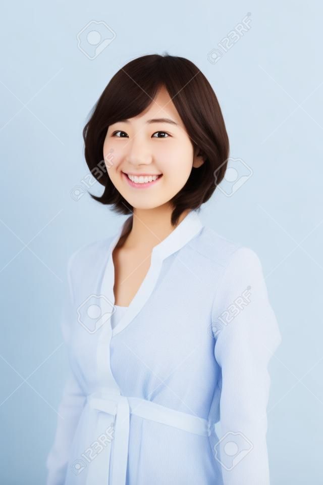 Smiling young Japanese women in white background