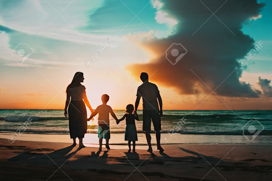 happy family with kids walk at sunset beach