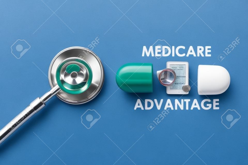 A picture of stethoscope with fake capsule, medicare advantage word, tablet, money shield and heart.