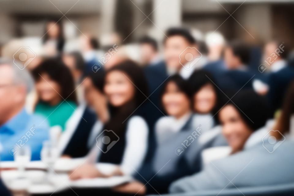 Out of focus, Blurred people sitting next to each other