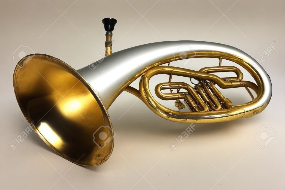 Old vintage tenor horn on a white