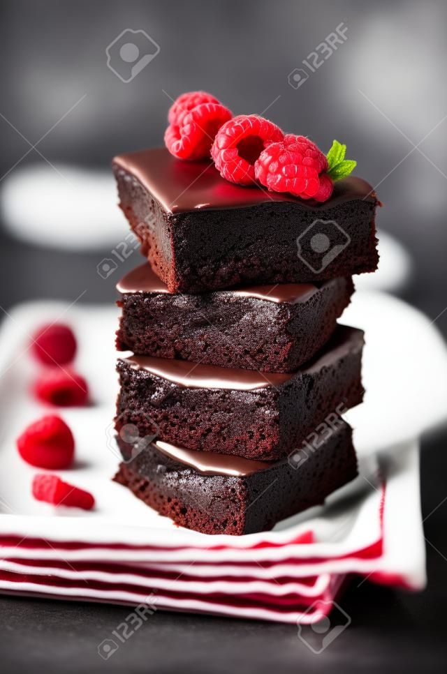 Chocolate cake Brownie with raspberries. toning. selective focus
