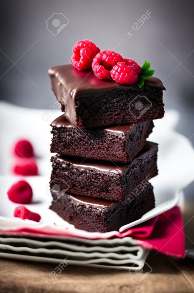 Chocolate cake Brownie with raspberries. toning. selective focus
