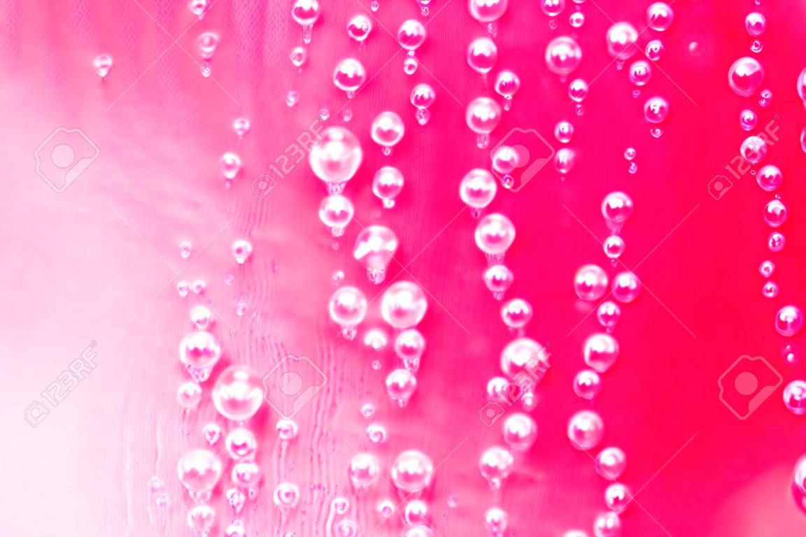 Pink water drops background