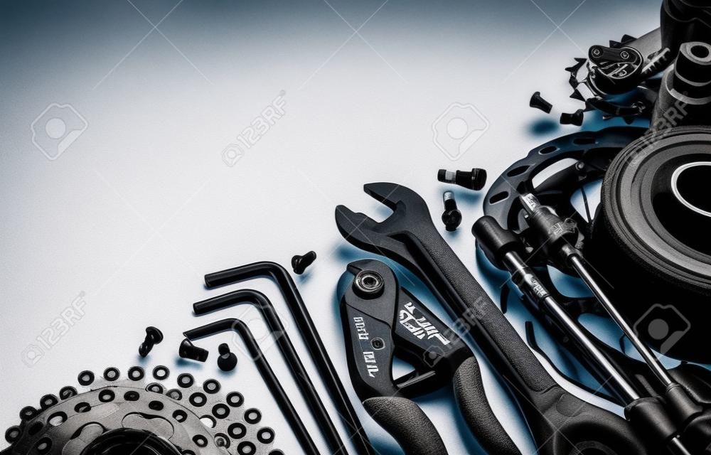 Mountain bike tools and spares on white background