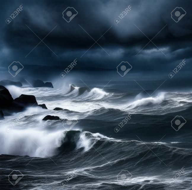 Dark stormy sky over ocean with big waves