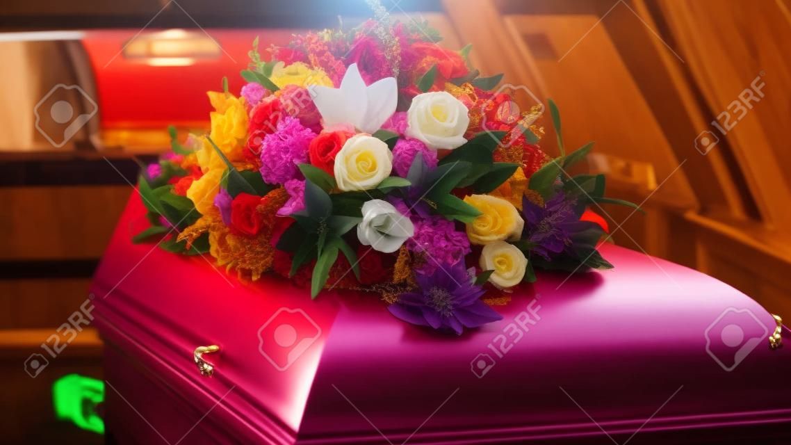 closeup shot of a colorful casket in a hearse or chapel before funeral