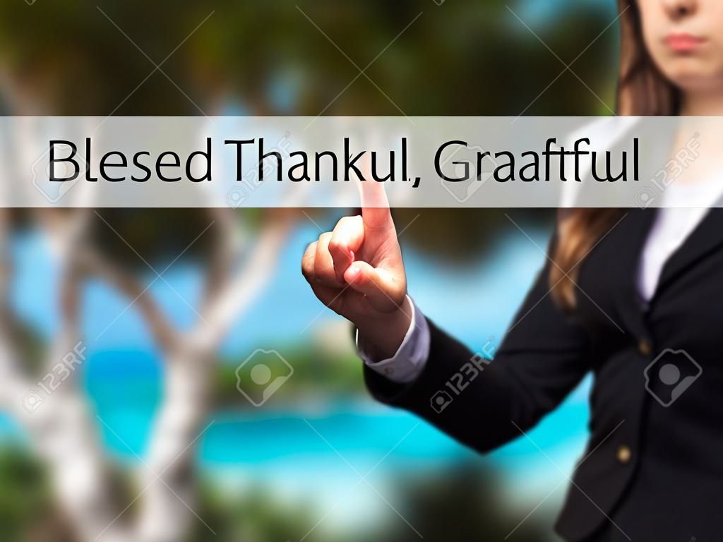 Blessed Thankful Grateful - Young girl working with virtual screen an touching button. Technology, internet concept. Stock Photo