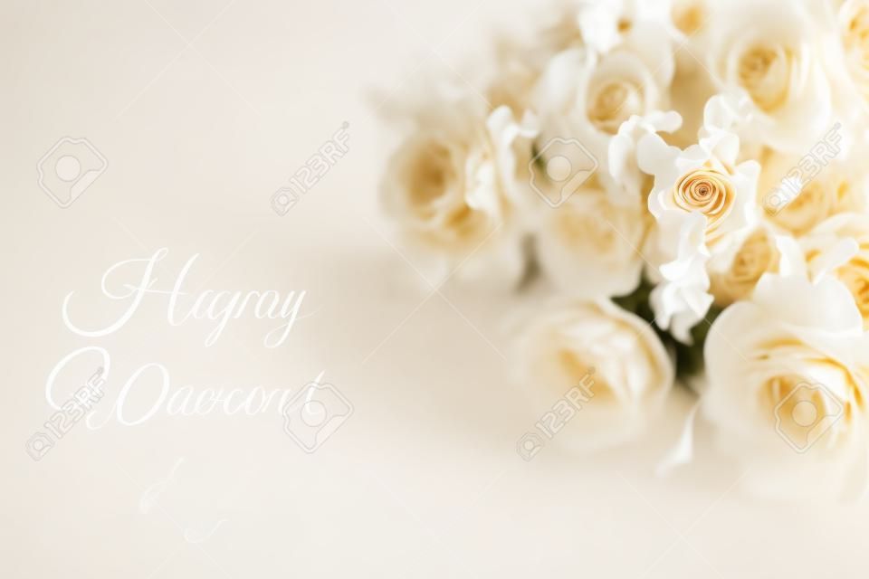 Beige carnation flowers bouquet on light beige background. Selective focus. Holiday decoration concept. Place for text. Banner for website.