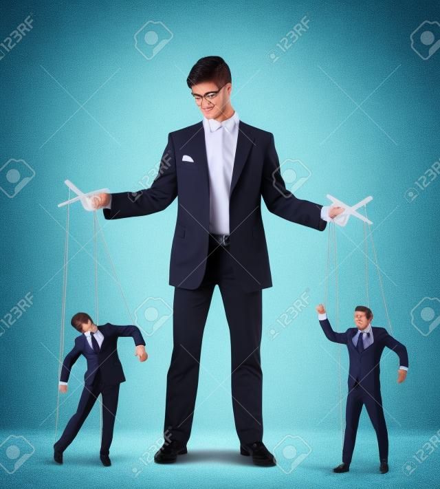 Image of young businessman puppeteer  Leadership concept
