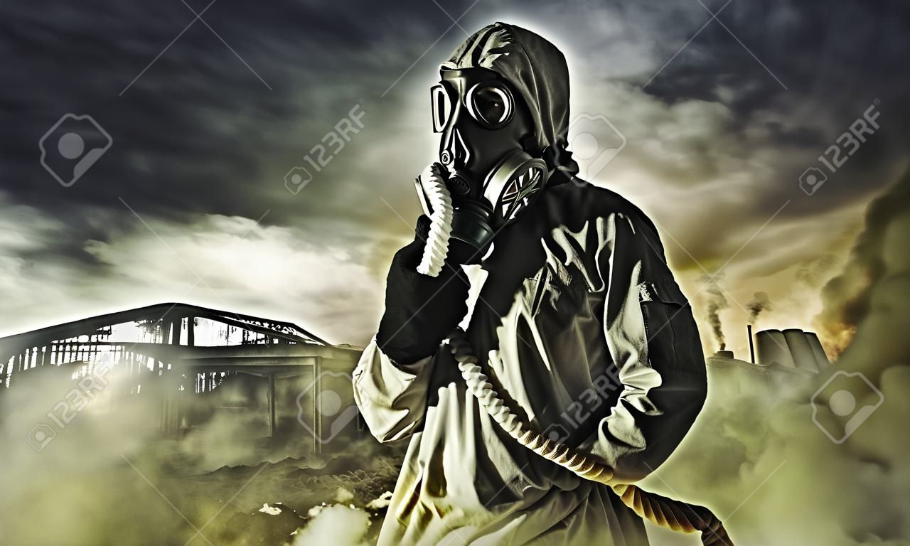 Man in gas mask against disaster background  Pollution concept