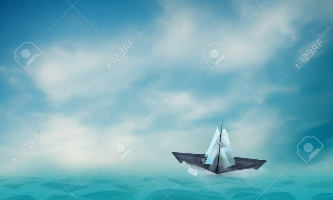 Papier-Schiff auf dem Wasser schwimmt auf den Wellen