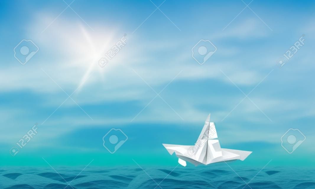 Paper ship floating on water on waves