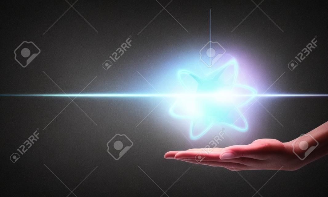 Human hand and atom molecule as science concept. 3d rendering
