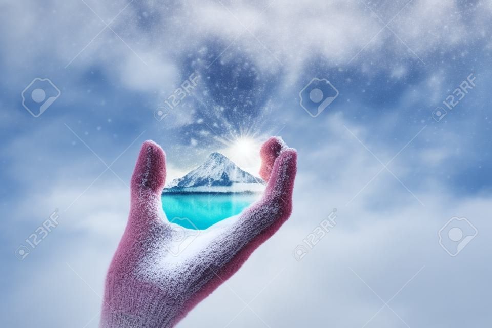 Mountain with snow top in hands