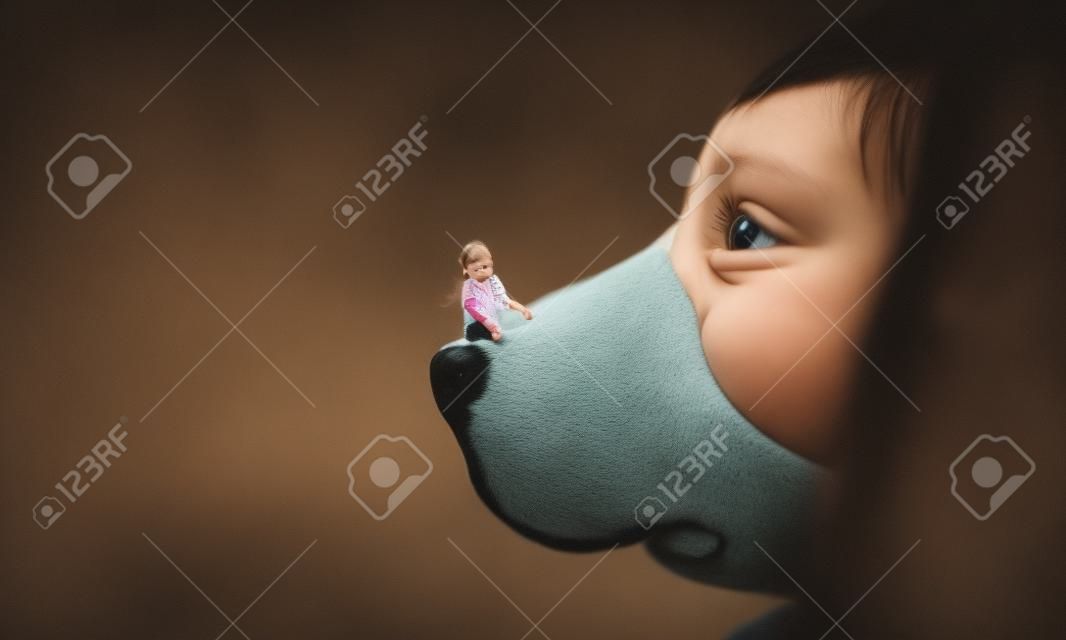 Little girl on dog nose