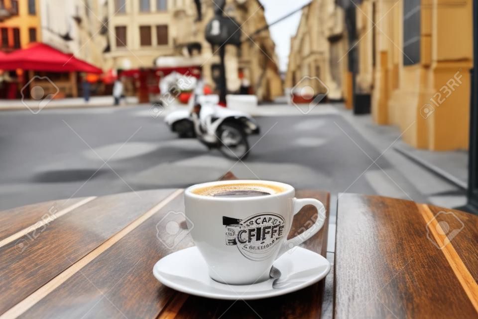 street cafe in Europe, cup of coffee on cozy vintage cafe terrace