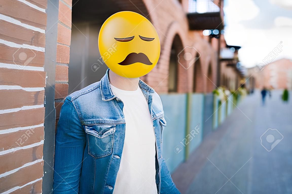Emoji head man in the street. Emoji concept