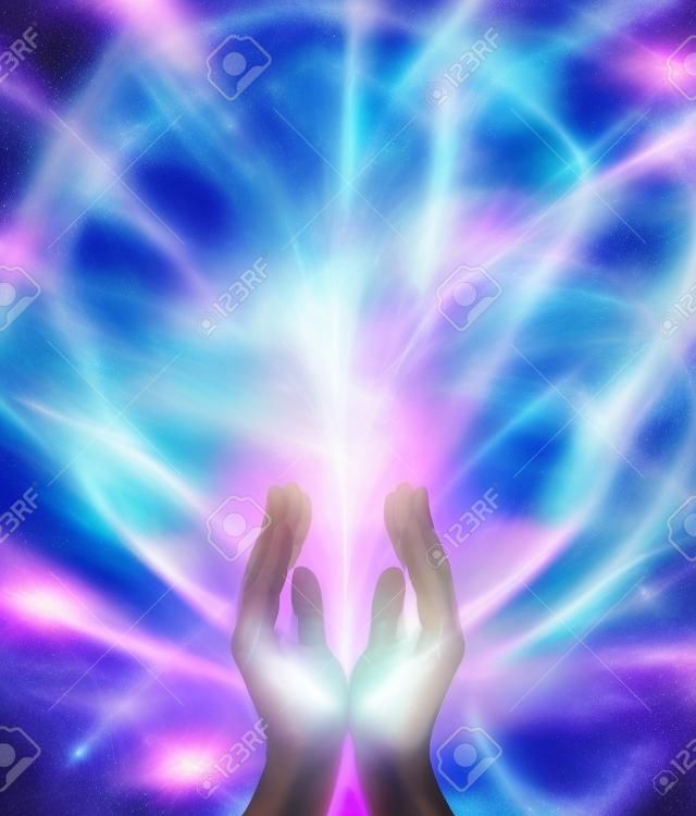 Beaming Reiki Healing Energy  Male parallel hands facing upwards with a beam of bright white energy flowing up on a pink and blue ethereal energy formation background