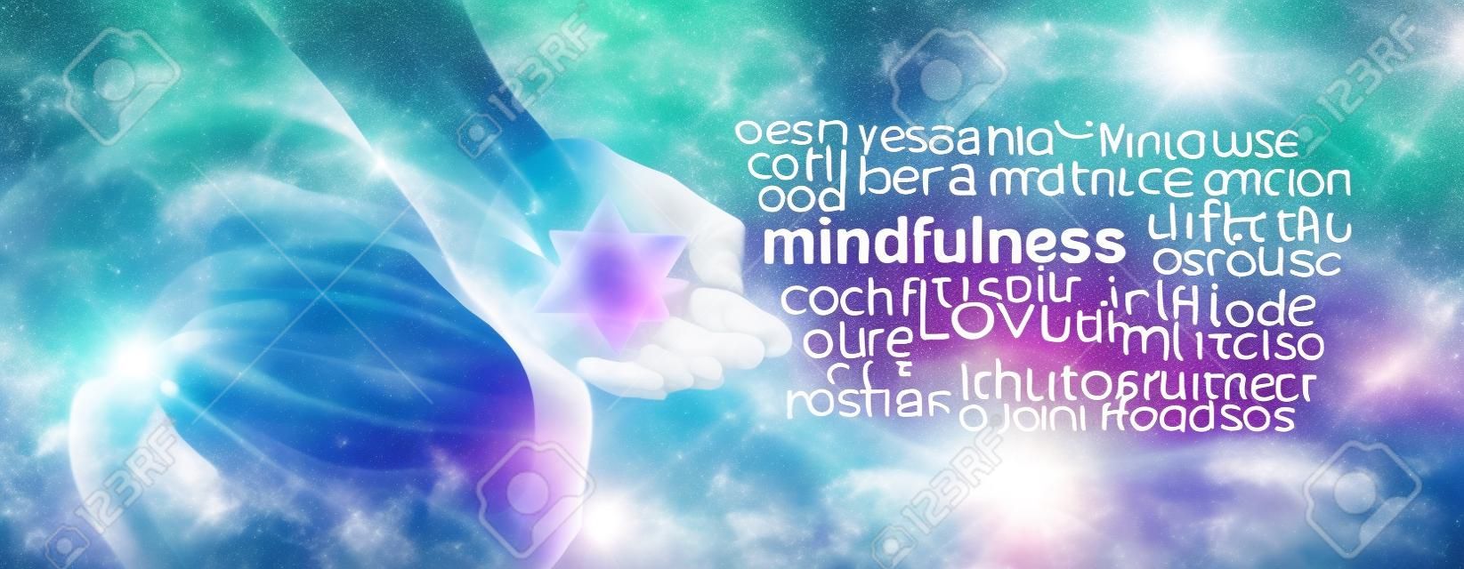 Mindfulness Meditation Word Cloud Banner - Female sitting in Lotus Position on left side with sunlight streaming in holding a Merkabah crystal meditating and a mindfulness word cloud on right side