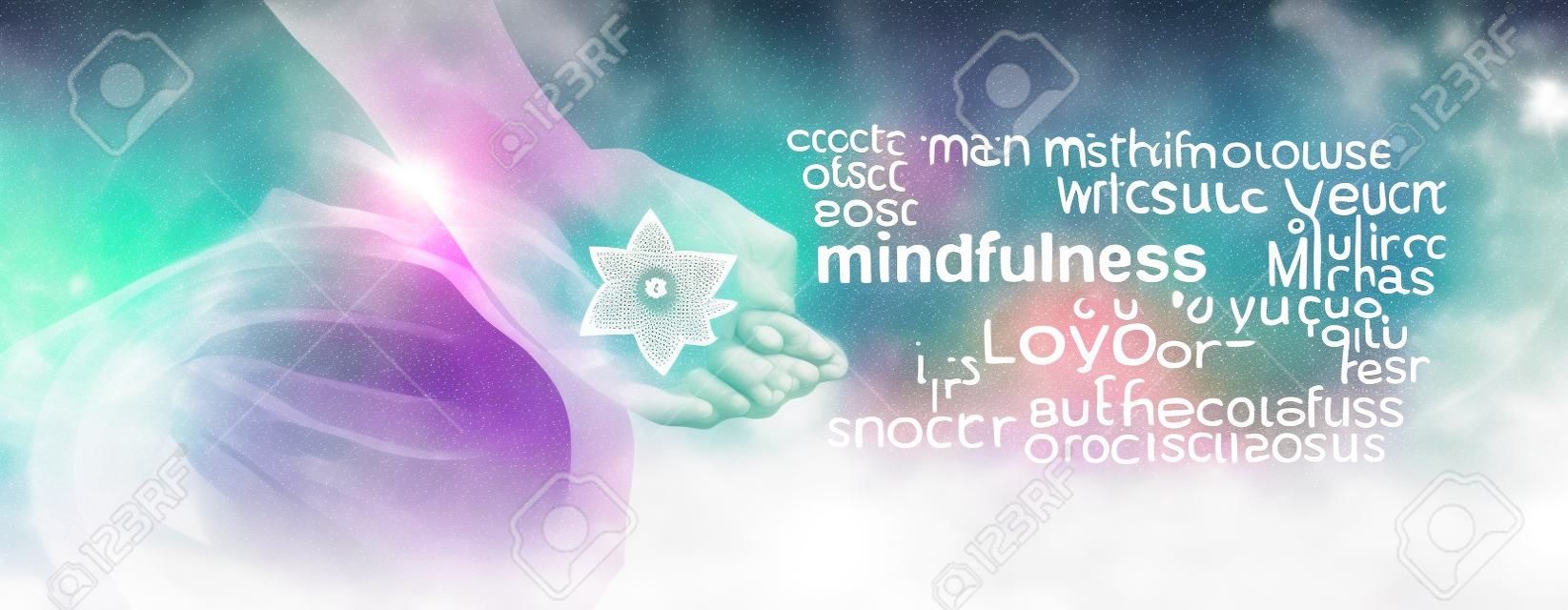 Mindfulness Meditation Word Cloud Banner - Female sitting in Lotus Position on left side with sunlight streaming in holding a Merkabah crystal meditating and a mindfulness word cloud on right side