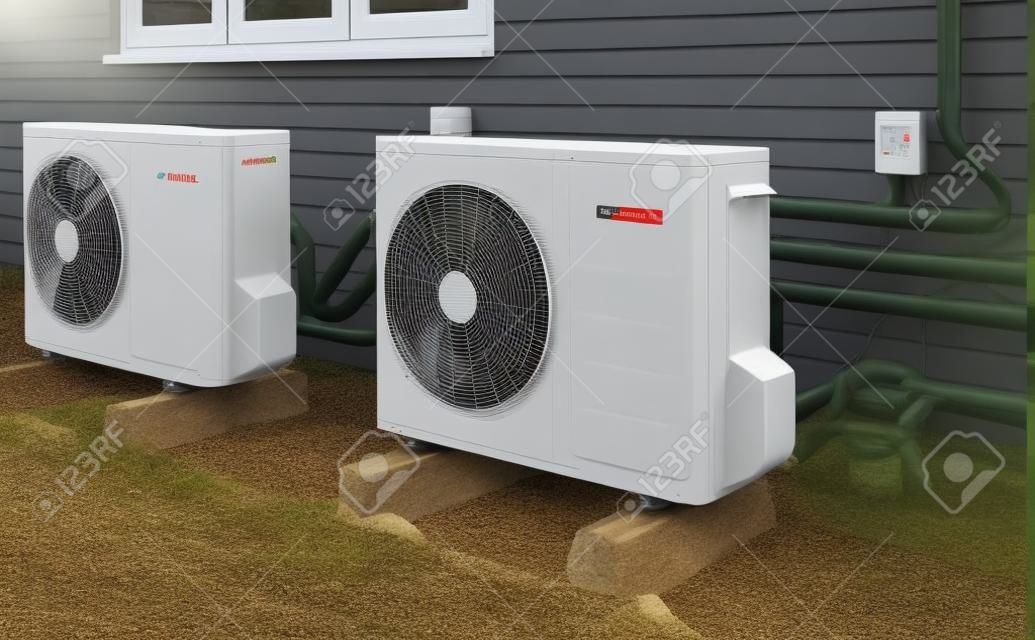 Deux unités de pompe à chaleur à air installées sur une maison moderne