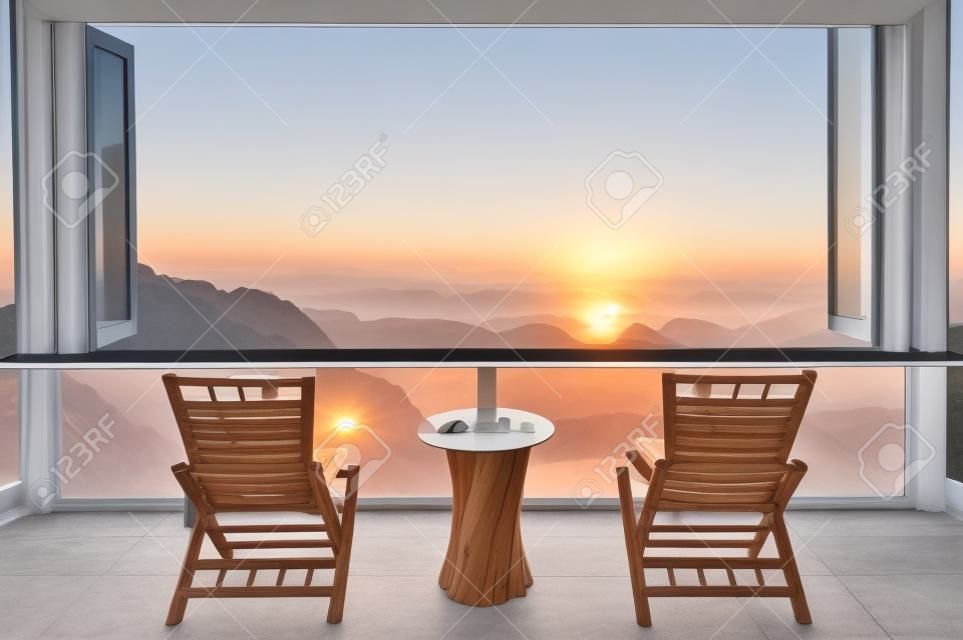 Beautiful landscape at cafe style minimal with wood tables and chairs terrace against the outdoor Mountain view in cafe at sunrise.
