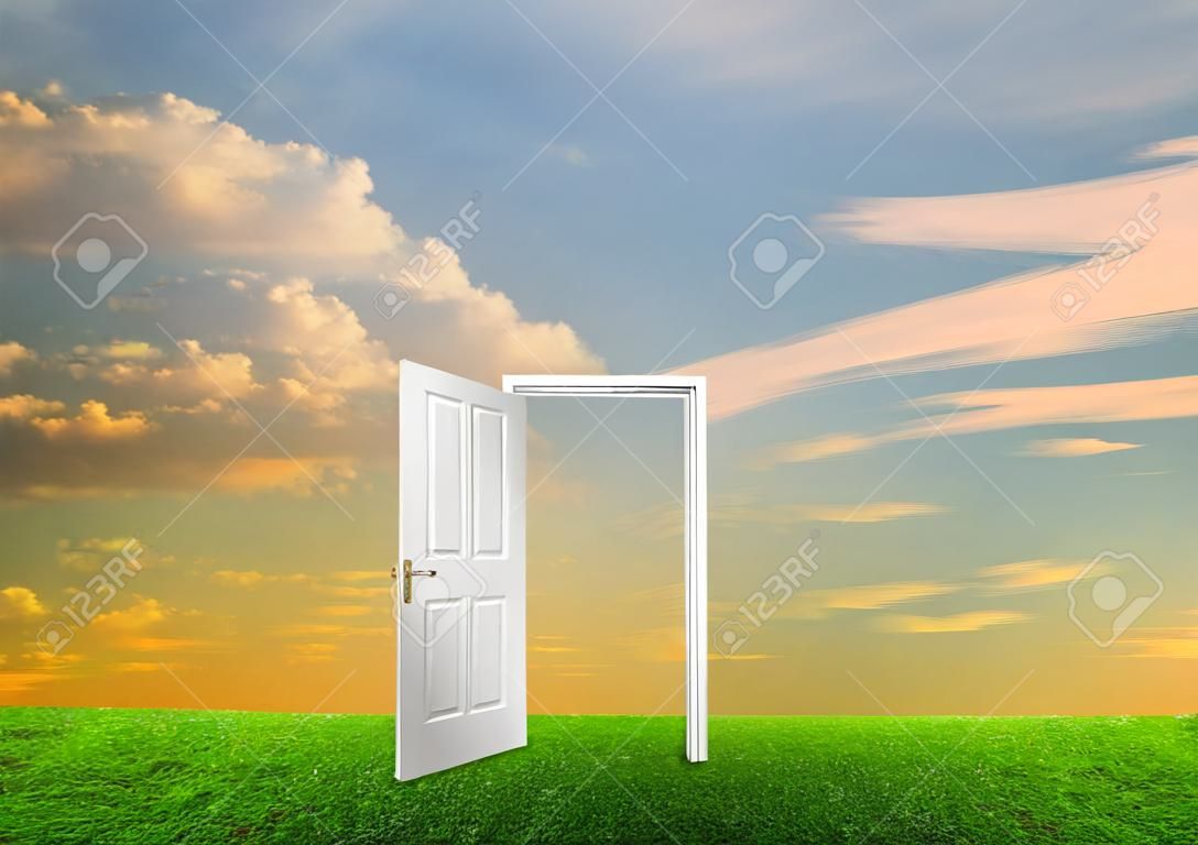 Open door to new life on the field. Hope, success, new life and world concepts.