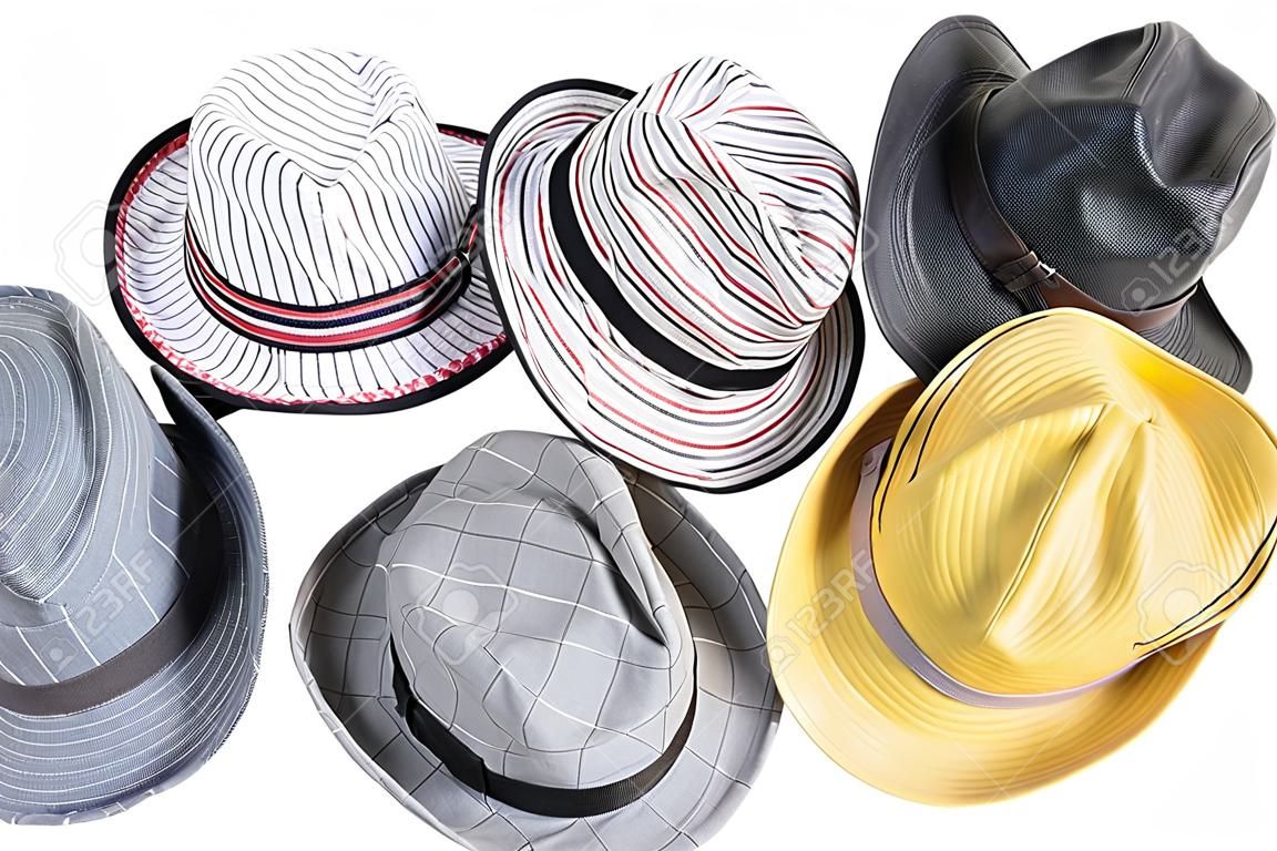 a pile of different hats isolated on a white background