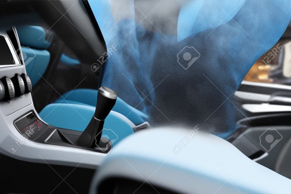 Dry cleaning of car interior with steam cleaner
