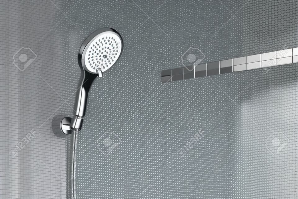 현대 샤워 헤드가 욕실 벽에 매달려 있습니다.
