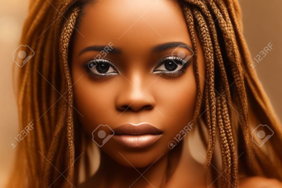 Portrait of a beautiful young African woman with braids, close-up.