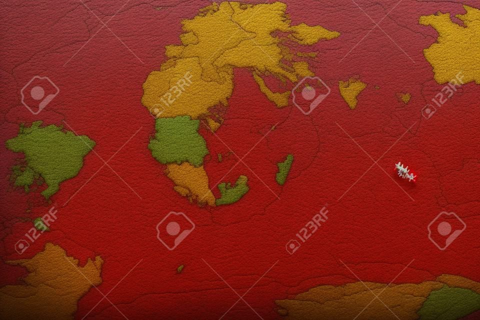 vista dall'alto. sfocatura astratta. mappa del mondo a colori con puntina rossa e gialla posizionata su di essi. questa immagine per internazionali, viaggi, attrezzature, concetto di paese