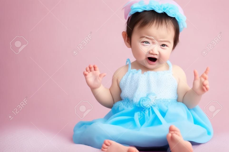 Little baby girl with funny expression