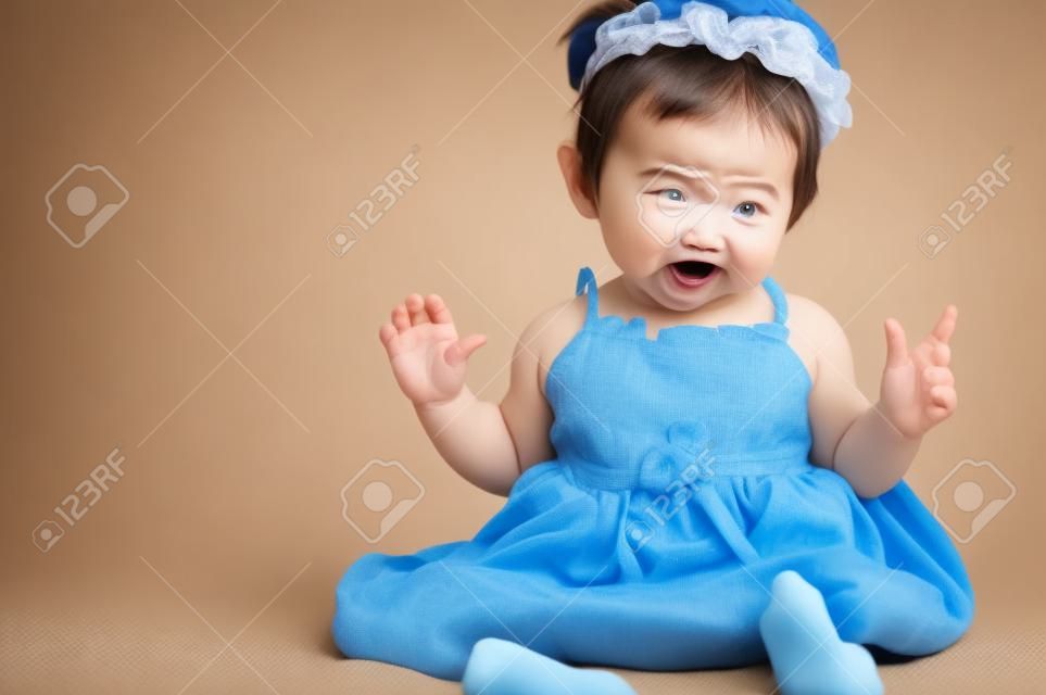Little baby girl with funny expression