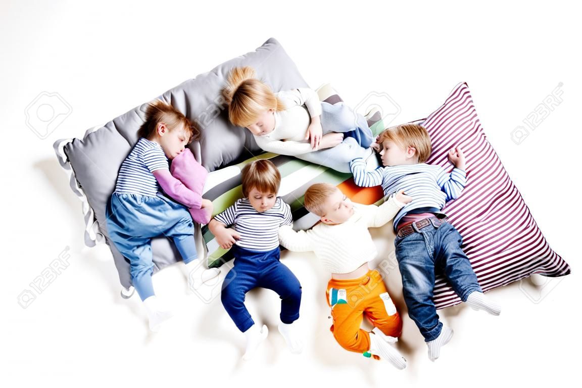 The children lie on the pillows