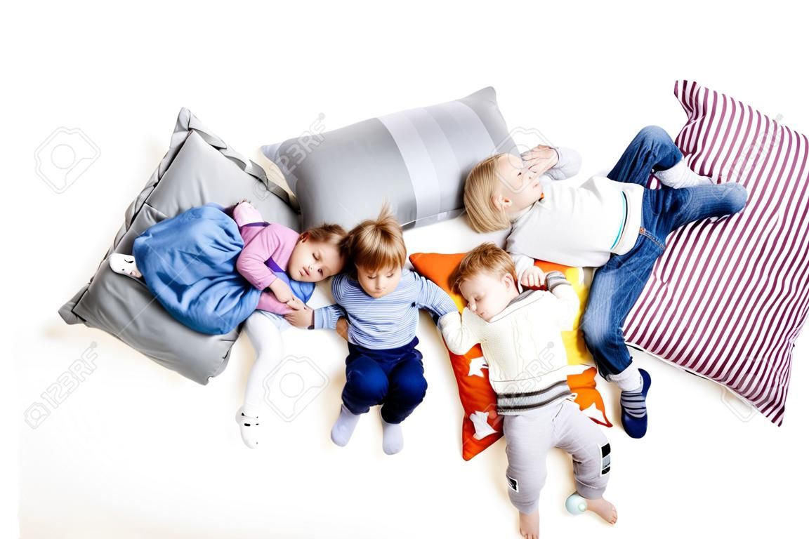 The children lie on the pillows
