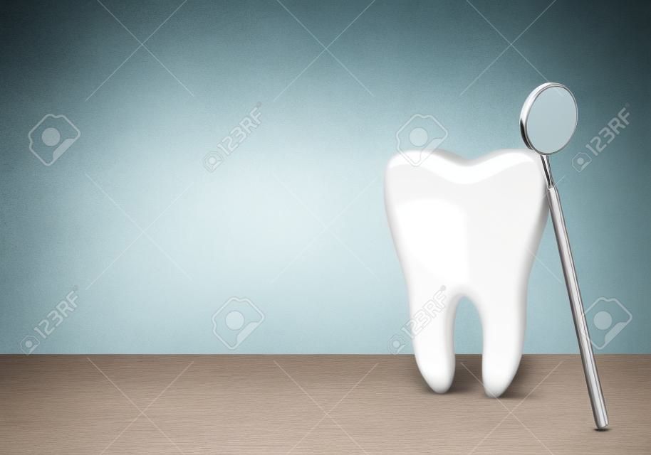 Grande dente e specchio del dentista nella clinica del dentista su priorità bassa