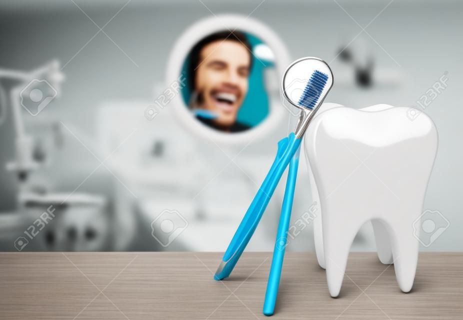 Grote tand en tandarts spiegel in tandarts kliniek op achtergrond