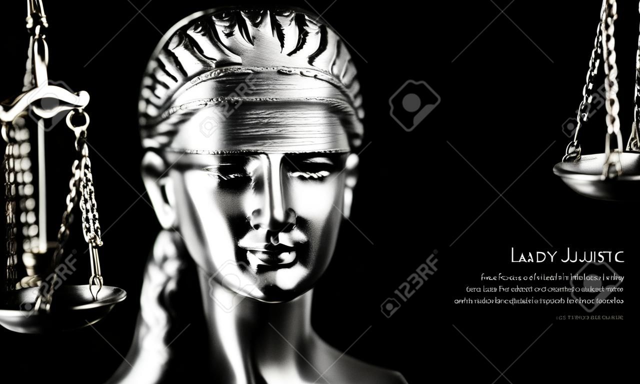 Face of Lady Justice in black background and space for text