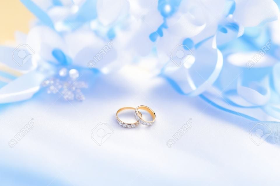Close-up of wedding rings on beautiful background