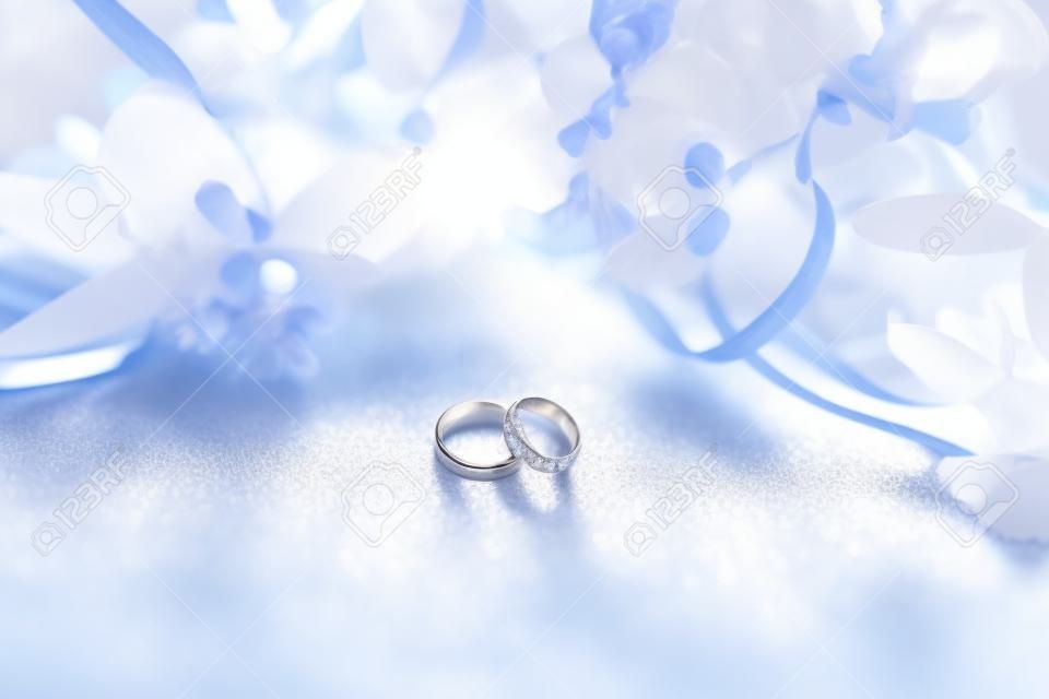 Close-up of wedding rings on beautiful background