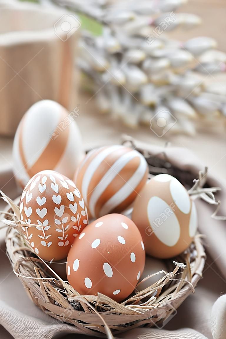 Village eco-friendly eggs painted in white ornament for Easter day.