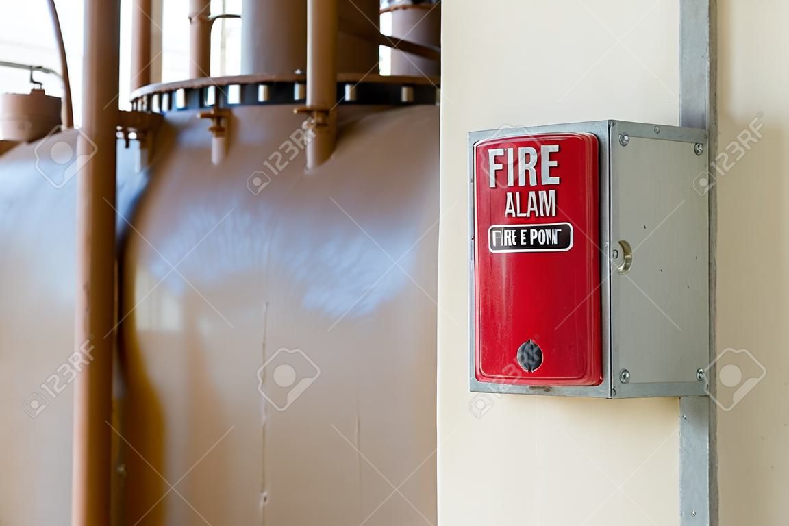 Fire Alarm or Fire Manual Call Point equipment in red box on the cement wall for warning, alert and sign to evacuation alarm building by exit passage way before Rescue Team attack the fire fighting.