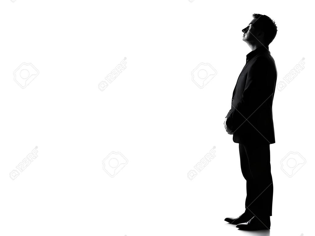 silhouette caucasian business man   profile serious looking up expressing behavior full length on studio isolated white background