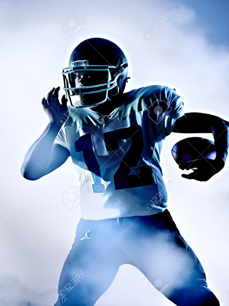 one american football player portrait in silhouette shadow on white background