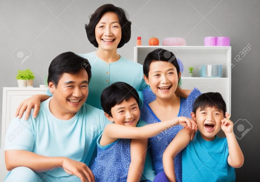 Asian family portrait with their grandmother. PS: stitching image for the tightly crop area of grandma's head make additional height to the image