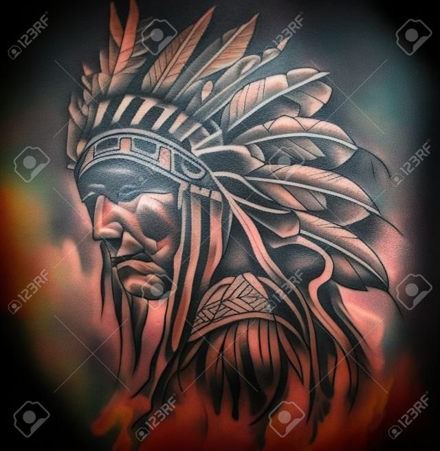 Tattoo art, portrait of american indian head over dark background
