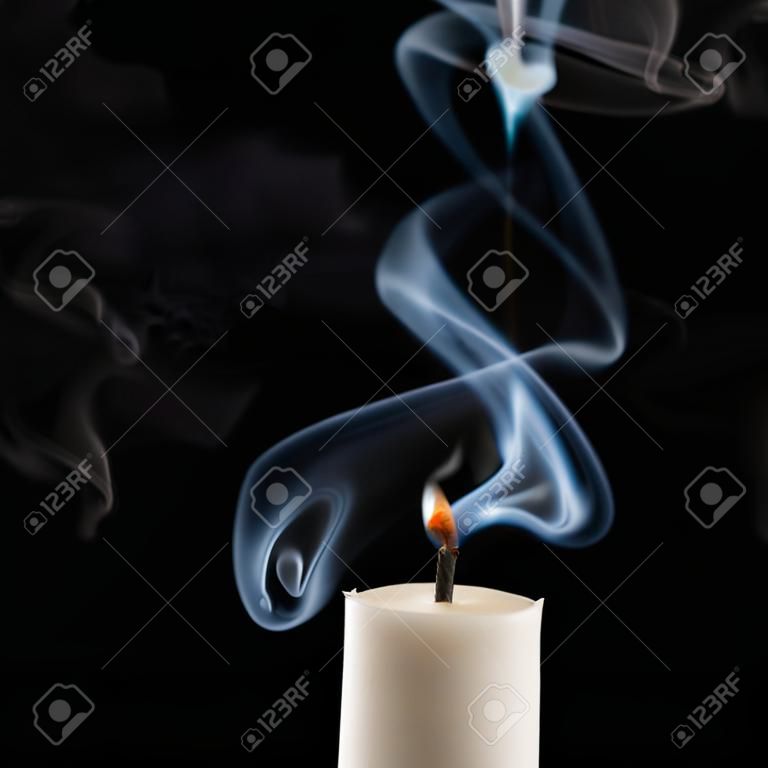 Extinguished candle with smoke