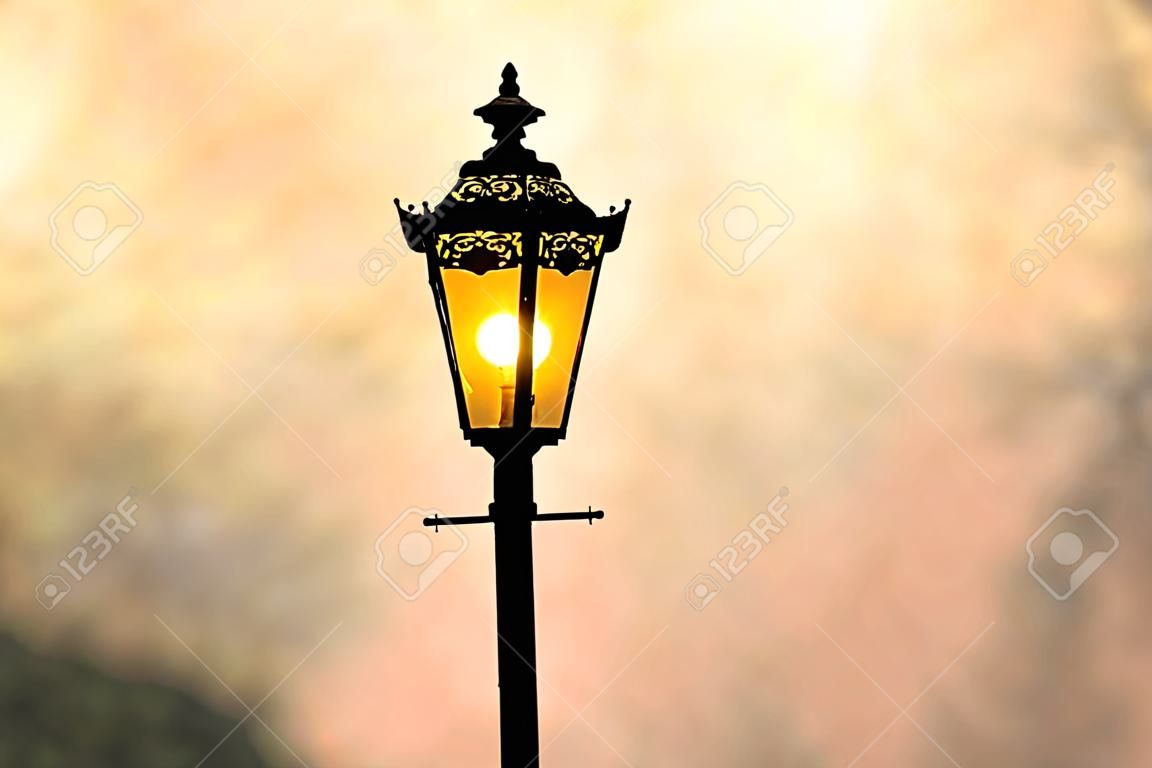 A classic style of lantern with sunset background (sillhouette)